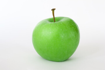 Fresh green apple isolated on white background. Healthy foods or snack.