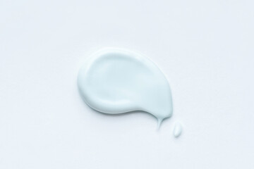 Smear of cosmetic cream or clay on a white background.