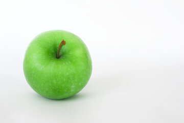Fresh green apple isolated on white background with space for text. Healthy foods or snack.
