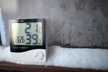 An electronic thermometer and hygrometer for temperature and humidity control is installed on the...