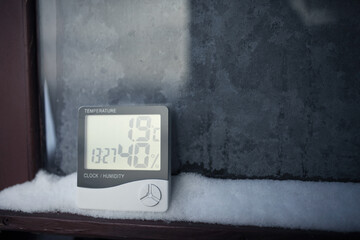 An electronic thermometer and hygrometer for temperature and humidity control is installed on the...