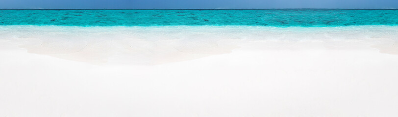 Tropical beach scene of azure crystal sea with soft waves. Long banner