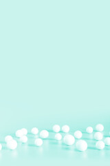 White spheres on light color background.  Copy space for text