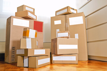 cardboard boxes for moving a new home or for shipment of sales or receipt of purchases , focus in foreground