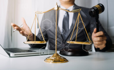 Business and lawyers discussing contract papers with brass scale on desk in office. Law, legal...