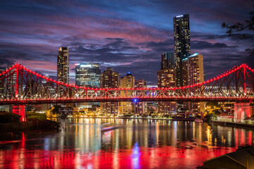 Naklejka na ściany i meble Brisbane's Storey Bridge at night with reflections.
