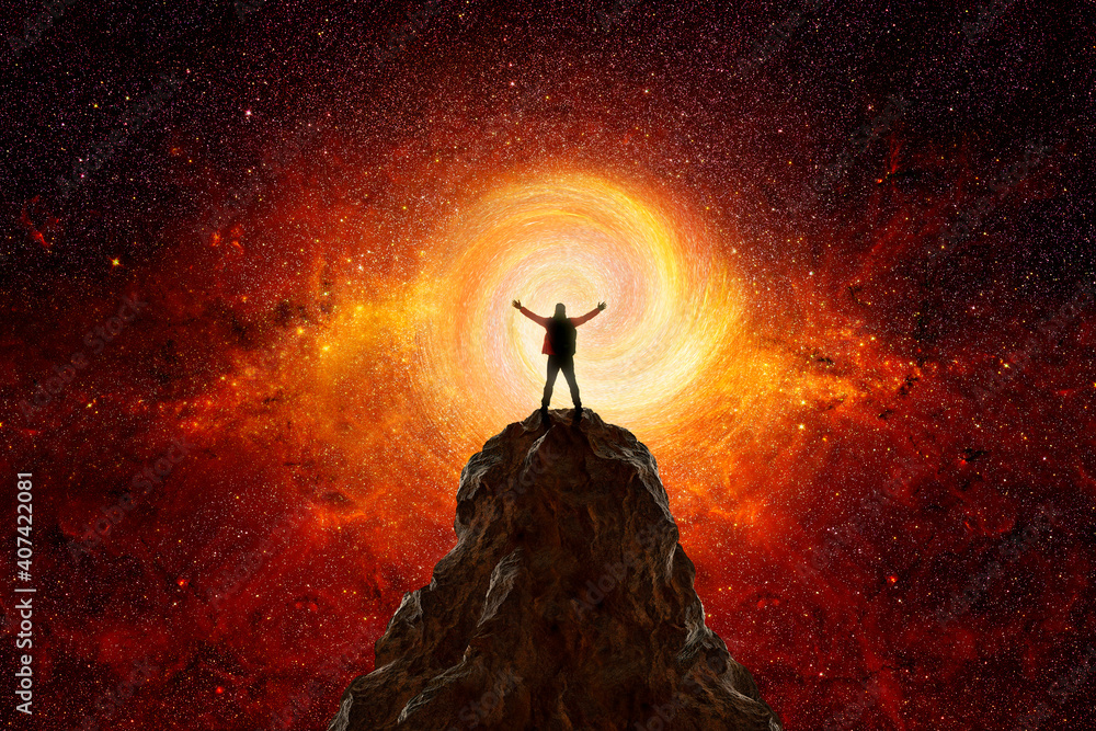 Wall mural man on top of a mountain observing the universe