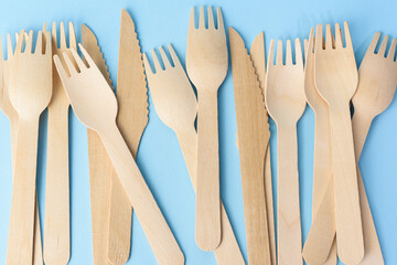 wooden forks and knives on a blue background
