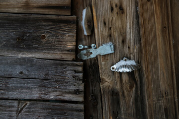 Old wooden door with antique lock background. Rustic texture