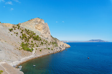 panorama of the sea mountain coast, Crimea the Black Sea coast on a sunny day . rocks on the shore, blue sky