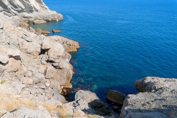 panorama of the sea mountain coast, Crimea the Black Sea coast on a sunny day . rocks on the shore, blue sky