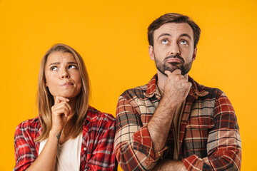 Beautiful brooding couple thinking and looking upward