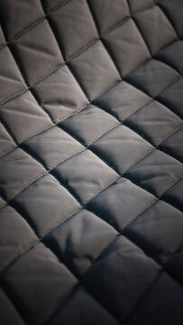 Tejido impermeable acolchado  en rombos negro 