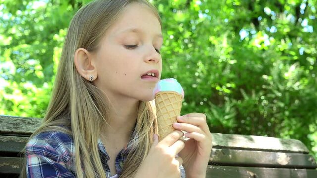 Kid Eating Ice Cream at Playground, Child Sitting on Bench in Park, Girl Relaxing Outdoor in Nature

