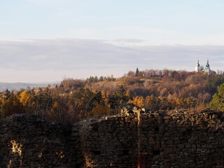 view from the medieval castle in the forest in the autumn afternoon, sunny cold day, wild nature, adventure trip, family travel,