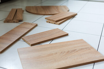 New disassembled cabinet on the floor in the kitchen of the apartment, close up
