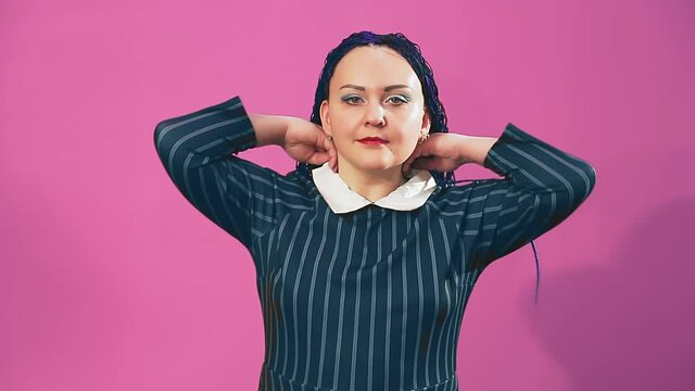 Stylish brunette Jewess with blue afro braids covers her hair
