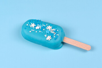 Blue mint ice cream popsicle on blue background. Tasty and refreshing ice cream on sticks. Minimal summer concept. Flat lay