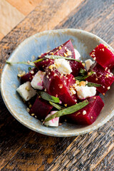 Beet salad. Classic Italian salad with beets, mozzarella, spinach, arugula, Parmesan cheese, olive oil, lemon juice, salt and pepper. A Fine dining restaurant classic.
