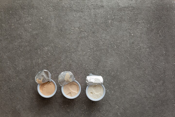 Vegetarian spread for sandwiches in jars on concrete background, top view