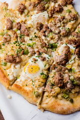 Flatbread pizza with meatballs, marinara sauce, Parmesan cheese and fresh Italian parsley. Classic American or Italian restaurant favorite. Homemade pizza dough with sauces, meats and cheeses.