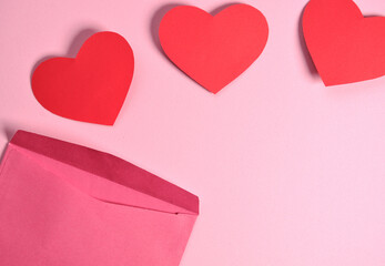 envelope with three paper hearts