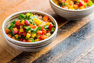 Mediterranean Mezze Salad. A Mediterranean classic Israeli salad made with sweet bell peppers, fresh mint, feta cheese and dressed with olive oil, lemon, and salt and pepper.