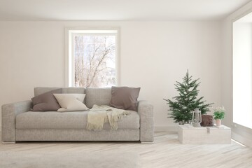 White living room with sofa and winter landscape in window. Scandinavian interior design. 3D illustration