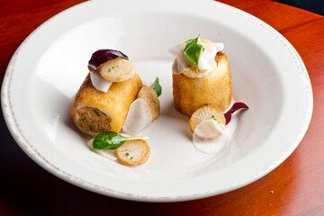 Pork belly. Pork belly seasoned with cracked black pepper and grilled. Pork served with classic steakhouse side dishes: asparagus and mashed potatoes. Classic fine dining entree.