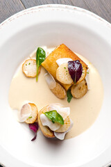 Pork belly. Pork belly seasoned with cracked black pepper and grilled. Pork served with classic steakhouse side dishes: asparagus and mashed potatoes. Classic fine dining entree.