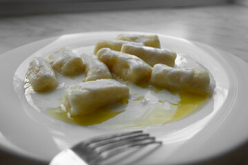 Closeup of dumplings with cottage cheese or Dumplings without filling - slavic light dish, vegetarian food, healthy breakfast
