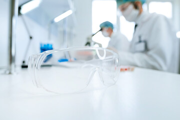 background image of scientists working in a scientific laboratory .