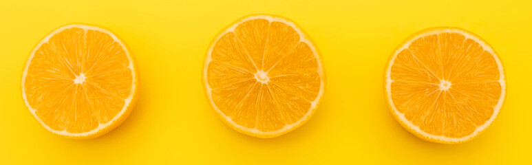 top view of juicy lemons halves isolated on yellow, banner