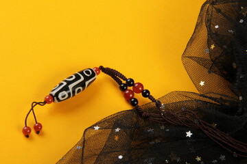Tibetan dzi bead amulet necklace, tibetan singing bowl and other Success and prosperity symbols on...