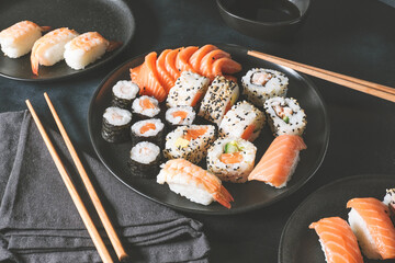 Japanese sushi food. Maki ands rolls with tuna, salmon, shrimp, crab and avocado. Top view of assorted sushi. sushi roll, uramaki, hosomaki and nigiri.