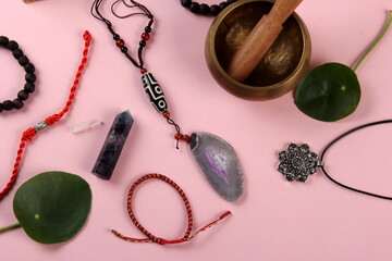 Tibetan dzi bead amulet necklace, tibetan singing bowl and other Success and prosperity symbols on...