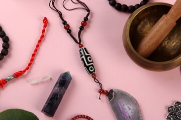 Tibetan dzi bead amulet necklace, tibetan singing bowl and other Success and prosperity symbols on...