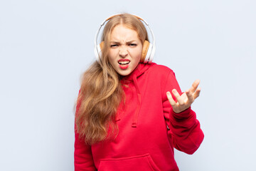 blonde woman looking angry, annoyed and frustrated screaming wtf or what’s wrong with you