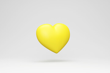 Yellow Love Heart on gray studio background
