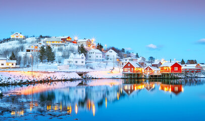 Dramatic evening cityscape of Reine town