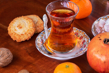 Tea and the Turkish delight on a table with selection of nuts and fruits