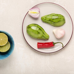 recipe for Mexican appetizer Guacamole with avocado and cilantro, top view