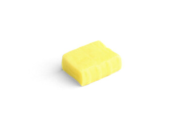 Yellow fruit chewing candies isolated on white background.