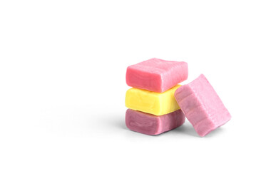 Colorful fruit chewing candies isolated on white background.