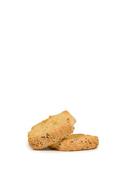 Pile of two wheat rusks with sesame seeds isolated on white background