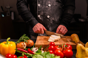 Tasty pepperoni pizza and cooking ingredients tomatoes basil on black concrete background. Top view of hot pepperoni pizza. With copy space for text. Flat lay. Banner