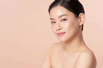 Beautiful young asian woman with clean fresh skin on beige background, Face care, Facial treatment, Cosmetology, beauty and spa, Asian women portrait