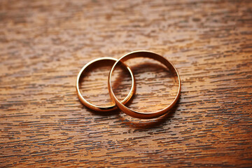 two wedding rings on a wooden surface. preparing for the wedding. close-up, macro