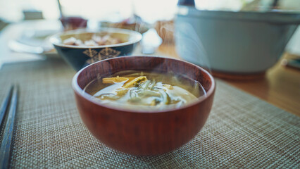  Hot miso soup is ready for lunch. Steam is on the soup.