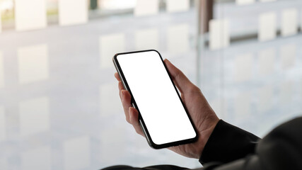 Close-up Of A Woman's Hand Holding Cell Phone With White Blank Screen